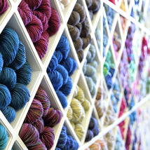 Yarn wall of colorful skeins - closeout yarns
