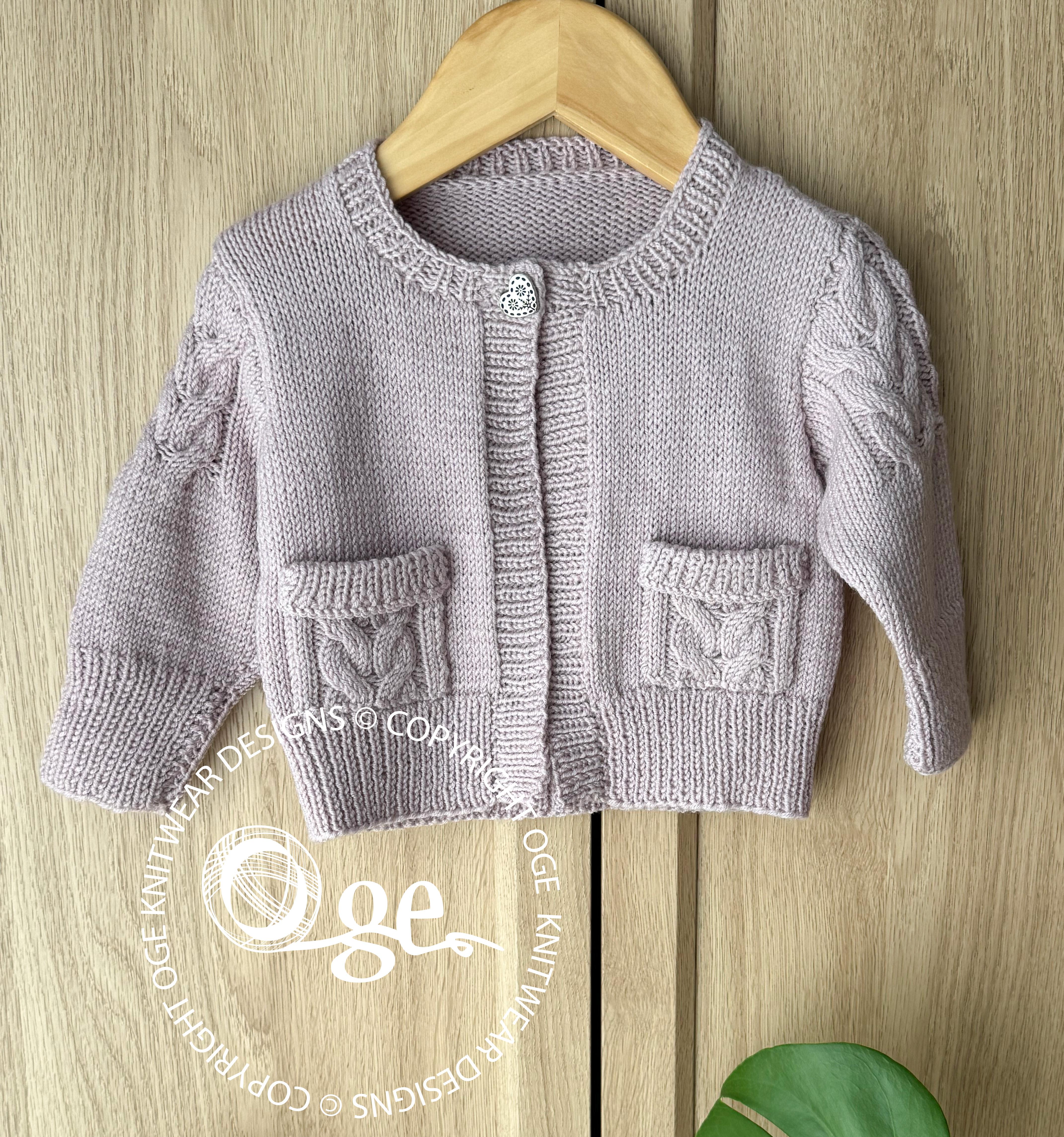 Child’s Cardigan with cable detail on sleeves and pockets - P065