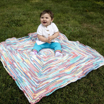 Mark The Spot Baby Blanket in Plymouth Yarn Dreambaby DK Paintpot