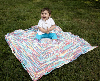 Mark The Spot Baby Blanket in Plymouth Yarn Dreambaby DK Paintpot